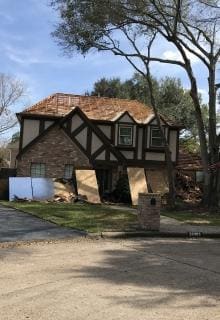 Removed wood shake shingles and installed plywood 